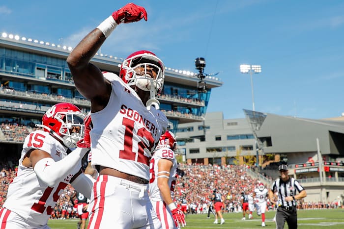 Sep 23, 2023; Cincinnati, Ohio, USA; Oklahoma Sooners defensive back Key Lawrence (12) reacts after intercepting the ball during the first half against the Cincinnati Bearcats at Nippert Stadium. Mandatory Credit: Katie Stratman-USA TODAY Sports